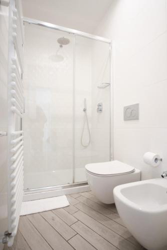 a bathroom with a shower and a toilet and a sink at Cinque Terre Bridge in La Spezia