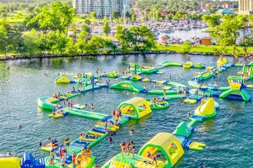 a group of inflatable slides and people in the water at Premier Affordable Barrie Suite in Barrie