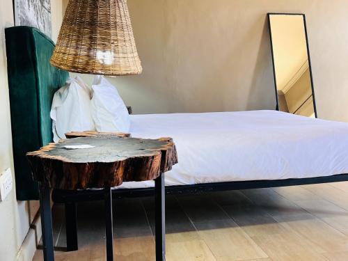 Cama o camas de una habitación en The Shed Venue & Boutique Hotel