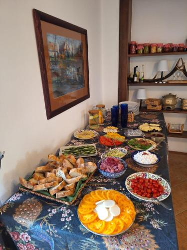 a table topped with lots of different types of food at Ranczo Brusno in Połczyn-Zdrój