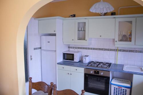 A kitchen or kitchenette at Sándor Apartman