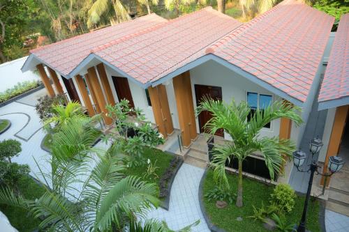 an aerial view of a house with an orange roof at Ramraj Resort in Kanyakumari