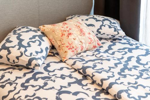two pillows sitting on top of a bed at Flexible SelfCheckIns 72 - Zagreb - Garage - Loggia - New in Zagreb