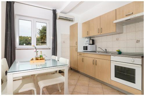 Kuchyň nebo kuchyňský kout v ubytování M&Z Apartmani