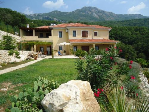 a large house with a garden in front of it at Lux Villa Provence in Budva
