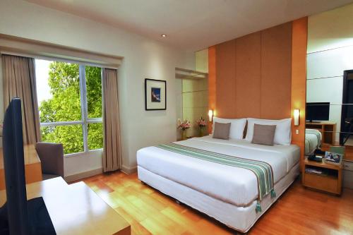 Cama o camas de una habitación en Somerset Berlian Jakarta