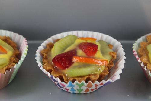 three muffins with fruit and vegetables in a paper wrapper at Hotel Royal Plaza in Rimini