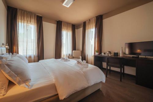 Postel nebo postele na pokoji v ubytování Hotel Palazzo Paradiso