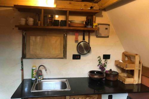 a kitchen with a sink and a counter top at Meru Eco Hideaway in Arusha