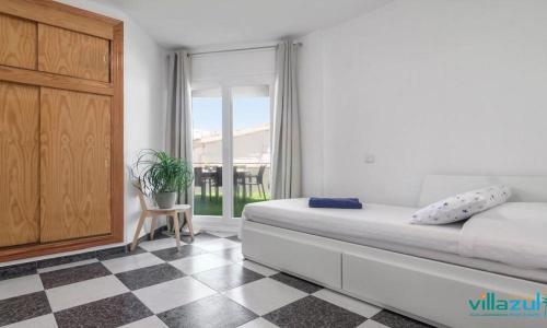 En eller flere senge i et værelse på Villa Paca