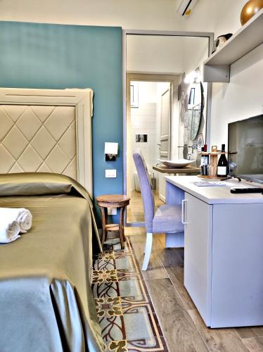 TV o dispositivi per l'intrattenimento presso Kèramos Luxury Rooms