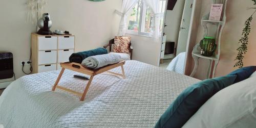 a room with a bed with a chair on it at Begutxi LVI00061 in Vitoria-Gasteiz