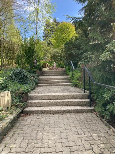 a set of stone stairs in a park at Gasthof Walhalja in Schmallenberg