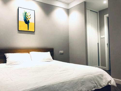 Katil atau katil-katil dalam bilik di ALTARA Quy Nhơn - RUBY Luxury Apartment