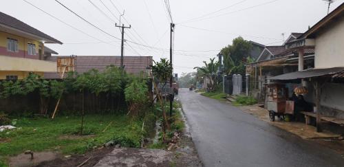 an empty street in a village with houses at 1Q rural in Sukabumi