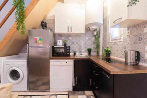 Η κουζίνα ή μικρή κουζίνα στο Magnifique duplex à Paris