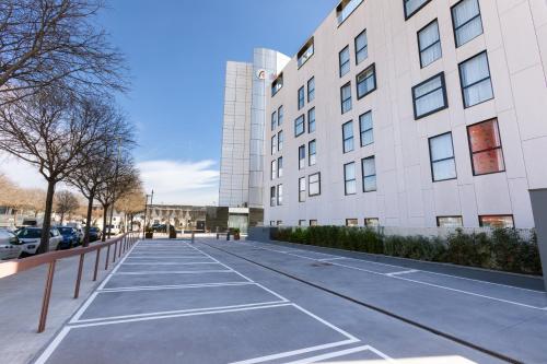 a parking lot in front of a building at Alexandre Fira Congress in Hospitalet de Llobregat
