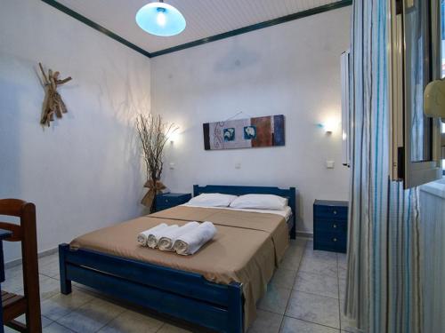 Ein Bett oder Betten in einem Zimmer der Unterkunft Toroni Dreams
