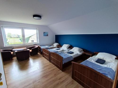 Llit o llits en una habitació de Pokoje u Gruszki