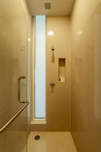 a shower with a glass door in a bathroom at Sunshine Beach Villa Mai Khao in Mai Khao Beach