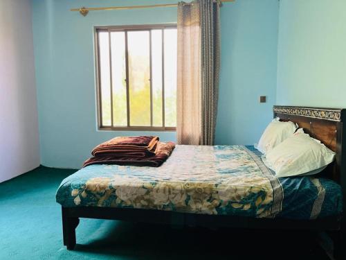 Кровать или кровати в номере Ilyasin Guest House