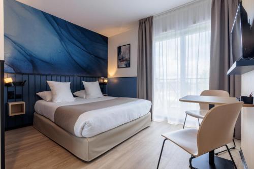 Säng eller sängar i ett rum på Résidence Du Parc Val d'Europe