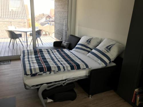 Postel nebo postele na pokoji v ubytování Sonnengarten 20 - Heimathafen