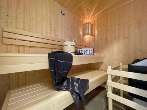 a sauna with wooden walls and wooden shelves at Sonnenweg 48-4 SAUERLANDBLICK in Heringhausen