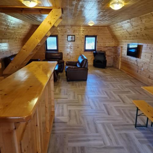 a room in a log cabin with a wooden floor at Bosaca 3 in Žabljak