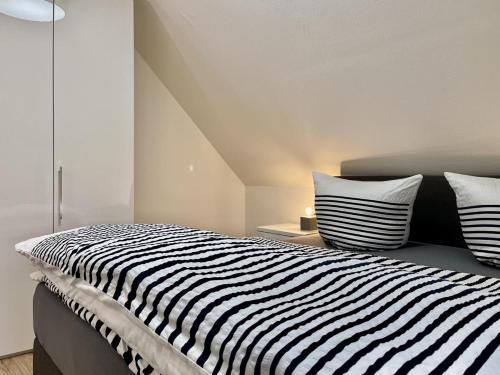 Postel nebo postele na pokoji v ubytování Am Kutterhafen 5 - SIELOASE