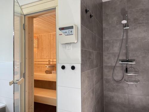 a bathroom with a shower with a bath tub at Diemelblick 17 in Heringhausen