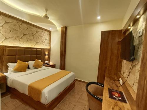 מיטה או מיטות בחדר ב-Hotel Riva International Goregaon- Near NESCO