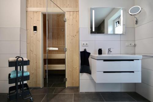 a bathroom with a sink and a mirror at Kellenhusen Tor 11 in Kellenhusen