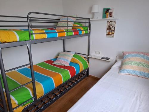 a bunk bed room with two bunk beds next to each other at 3 Bed Chalet-Pool-Pets-Hot Tub-Parking-Garden in Chiva