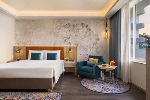 Ein Bett oder Betten in einem Zimmer der Unterkunft Ekante Bliss Tirupati - IHCL SeleQtions