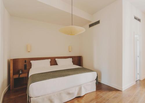 Katil atau katil-katil dalam bilik di Hotel Regina Barcelona