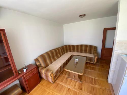 a living room with a couch and a table at Apartments TEA in Trebinje