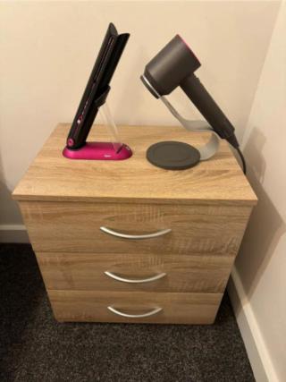a desk with a lamp on top of a dresser at 1-Bedroom Flat in Islington! in London