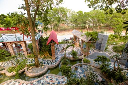an aerial view of a garden with a pond at Bungalow HTC tuần châu in Ha Long