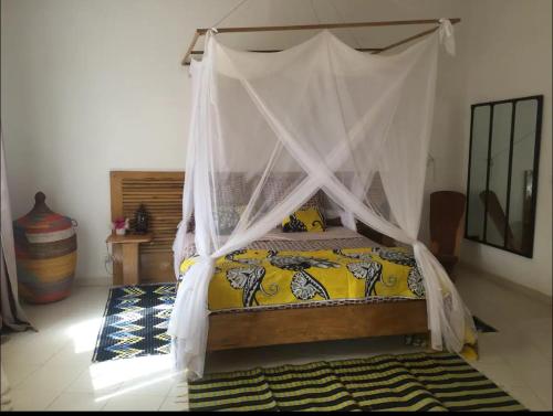 Posteľ alebo postele v izbe v ubytovaní Warang plage villa