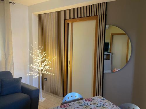 a living room with a couch and a mirror at Belvedere Lacinio -Casa Vacanze- in Crotone