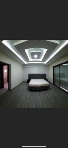 a room with a bed in the middle of it at Villa mima in Midoun