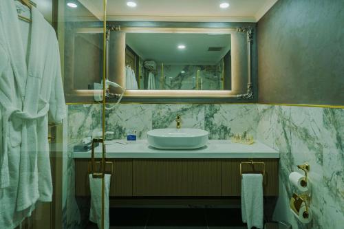 a bathroom with a sink and a mirror at La Quinta by Wyndham Giresun in Giresun