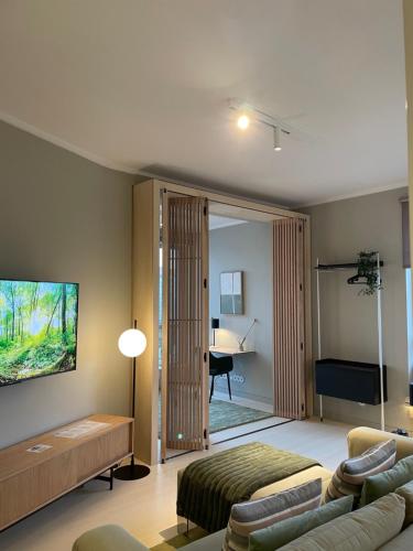 a living room with a couch and a desk in it at BestHomeStay-Lisbon (Campolide) in Lisbon