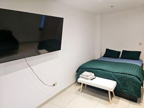 Posteľ alebo postele v izbe v ubytovaní appartement ouvert sur une pièce