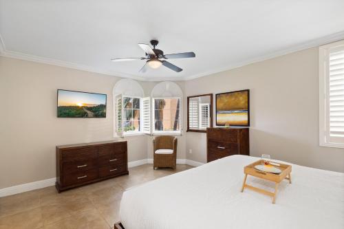 a bedroom with a bed and a ceiling fan at Divi Village Condo 6 J.E. Irausquin Blvd 93 in Palm-Eagle Beach