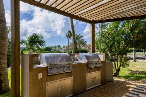 a outdoor kitchen with two burners on a patio at Divi Village Condo 6 J.E. Irausquin Blvd 93 in Palm-Eagle Beach