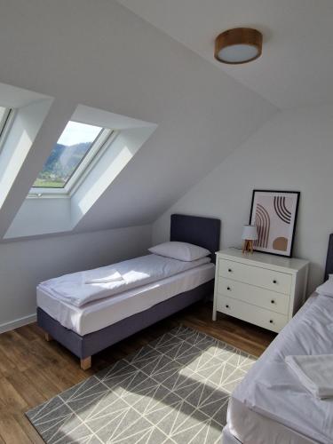 Una cama o camas en una habitación de Pod 8 Lipami