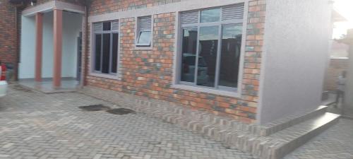 a brick building with windows on the side of it at RUbuto ABNB in Kigali