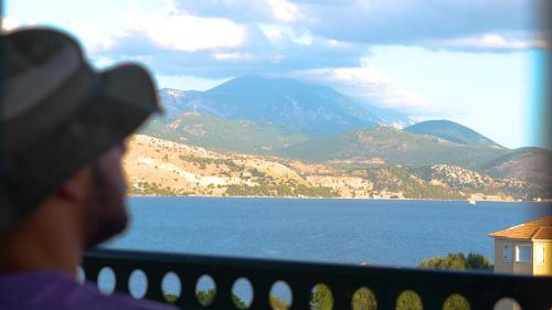 a person looking out at a large body of water at Remenata in Lixouri